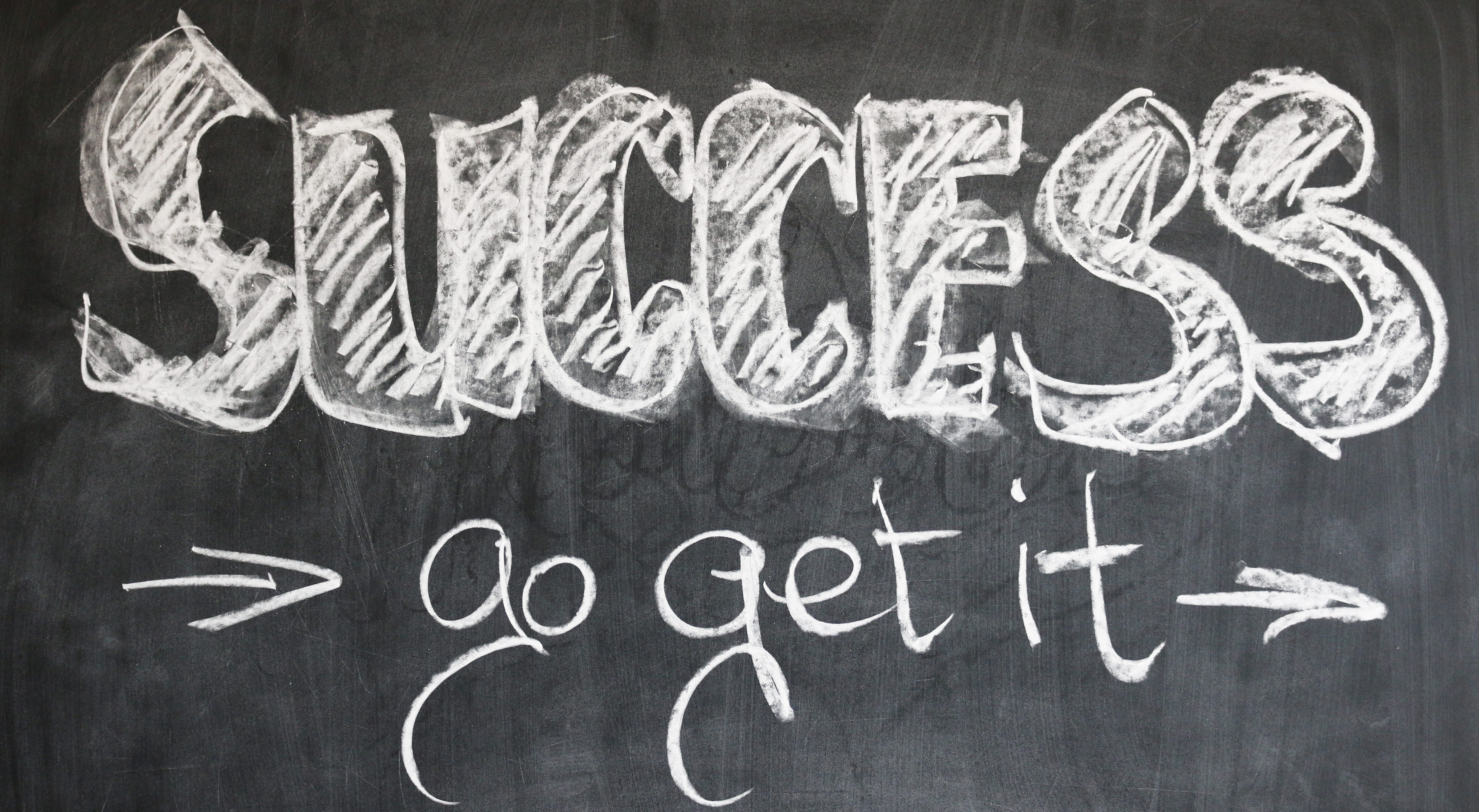 Chalkboard with writing that says Success go get it.